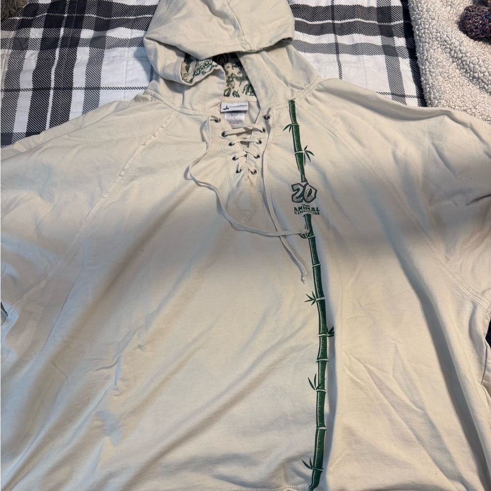 Disney Parks Animal Kingdom Cream Hoodie with Green Pattern